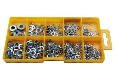 Assorted spring and flat washers in yellow compartment case, metal fasteners organized by size