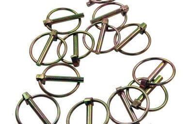 Assorted metal lynch pins and ring clips for securing machinery or trailer parts