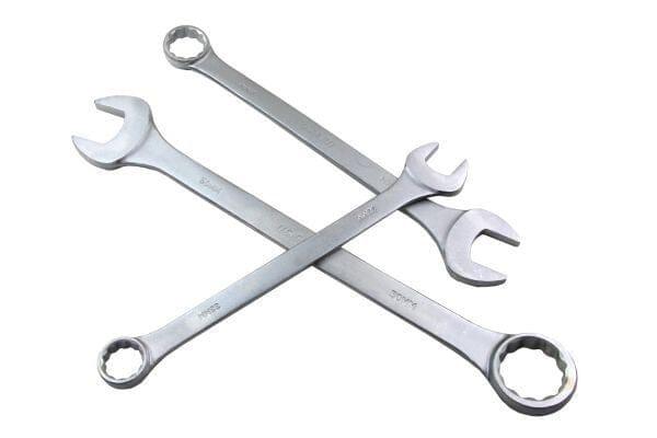 Set of large combination spanners with open and ring ends crossed on white background